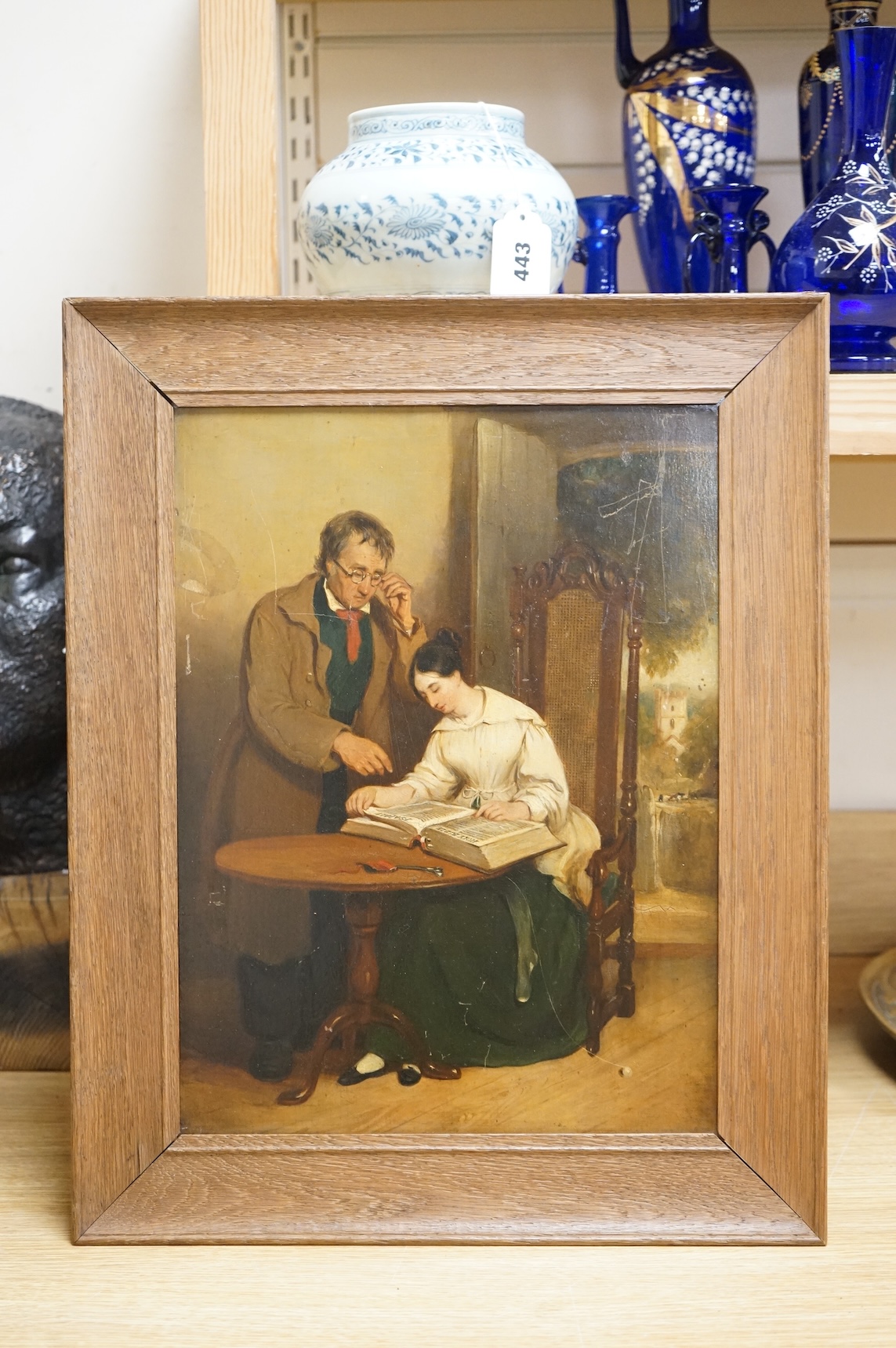 19th century, English School, Interior scene with lady and gentleman reading, unsigned, oil on millboard, 40 x 29cm